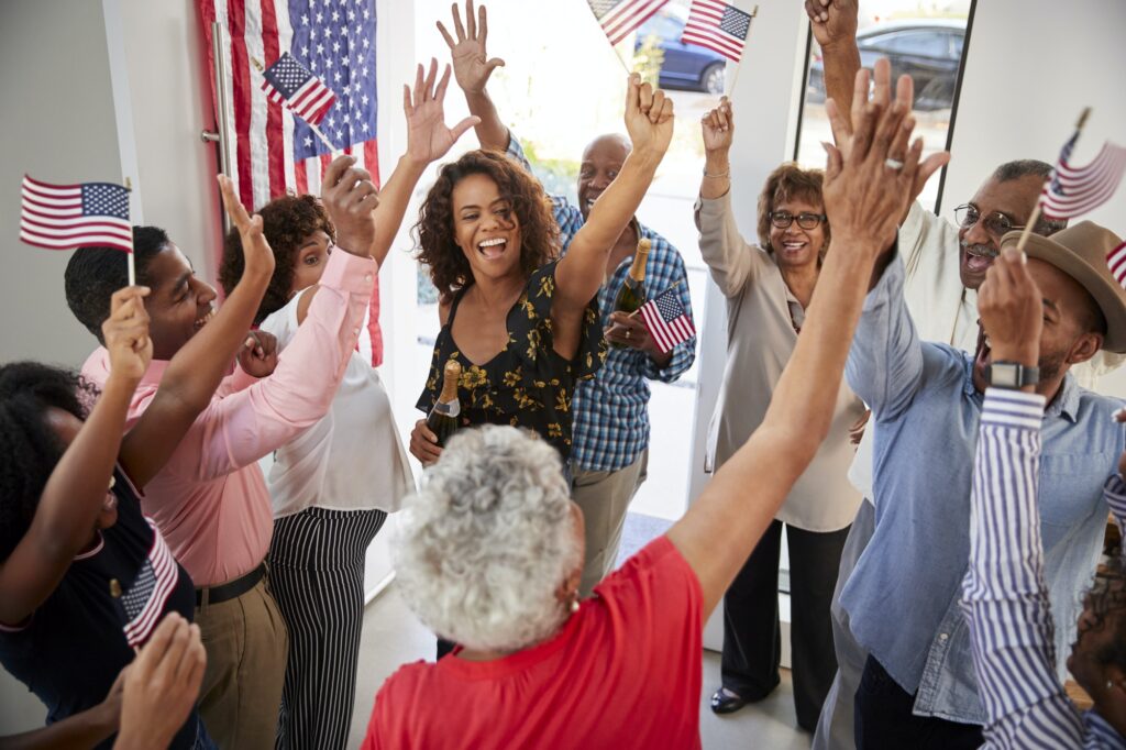 Three Generation Black Family Celebrating Independence Day Together At Home Elevated View 1024x682